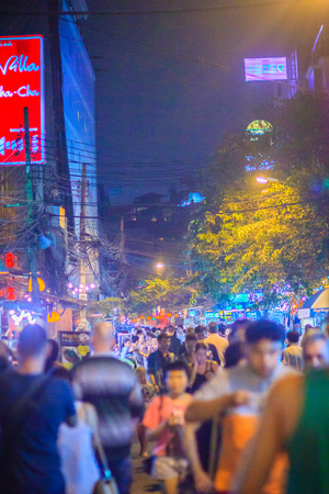 Bangkok, Thailand - March 2, 2017: Tourists enjoy night life at Rambuttri Alley signboard at night, a popular food street nearby Khaosan road and famous district for backpacker and budget tourist.のeditorial素材