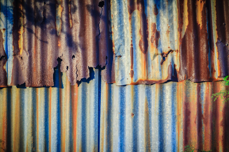 Background texture of the wall of old zinc sheet, metal sheet with rusty texture, rusty metal sheet, rusty zinc textureの写真素材