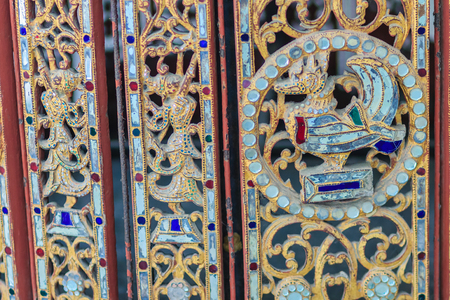 Patterns of golden craving swan and angels on the old wallの写真素材