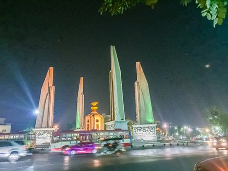 Bangkok, Thailand - March 2, 2017: The democracy monument at night with colorful light and traffic jam.のeditorial素材