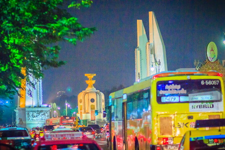 Bangkok, Thailand - March 2, 2017: The democracy monument at night with colorful light and traffic jam.のeditorial素材