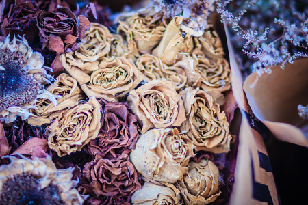 Dried wedding roses flower bouquet background. Close up bouquet of dried withered roses.の写真素材