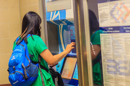 Bangkok, Thailand - April 23, 2017: Unidentified passenger buying a ticket from a ticket vending machine in Hua Lamphong MRT (Metropolitan Rapid Transit) subway stationのeditorial素材
