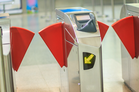 Automatic access control ticket barriers in subway station. View of barrier gate before access in to subway station. Automatic ticket barriers at subway entrance.の写真素材