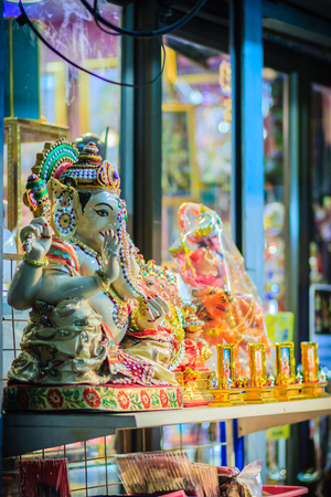Colorful night view of indian gods sculpture at Sri Maha Mariamman Temple, also known as Maha Uma Devi temple, the public hindu temple in Silom, Bangkok, Thailand. It known as Wat Khaek Silom.の写真素材