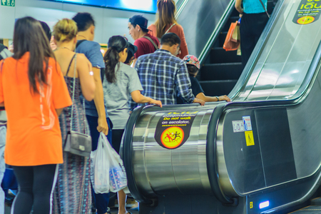 Bangkok, Thailand - April 23, 2017: Crowd of passengers using the escalator to exit the subway stationのeditorial素材