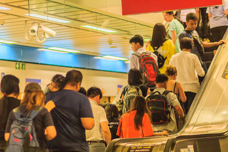 Bangkok, Thailand - April 23, 2017: Crowd of passengers using the escalator to exit the subway stationのeditorial素材
