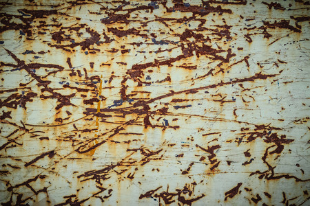 Scratched and rusty steel wall for background. Grungy metal plate with scratched texture for...