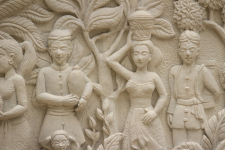 Beautiful white Java stucco patterned on the boundary wall. Vintage white wall bas-relief stucco in plaster, depicts Lotus flowers background.のeditorial素材