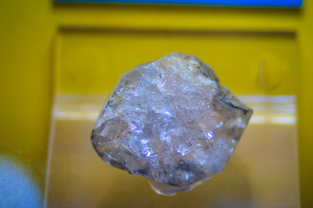 Raw specimen of quartz crystal stone from mining and quarrying industries. Quartz is a mineral composed of silicon and oxygen atoms that commonly used in the making of jewelry and hard stone carvings.の写真素材