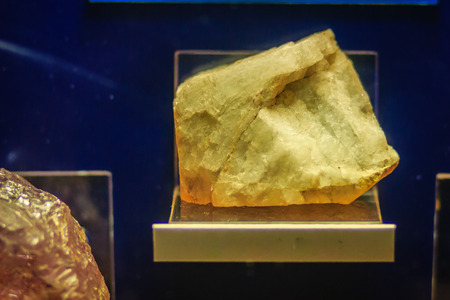 Topaz rock specimen from mining and quarrying industries. Topaz is a silicate mineral of aluminium and fluorine. Topaz crystallizes are mostly prismatic terminated by pyramidal and other faces.の写真素材
