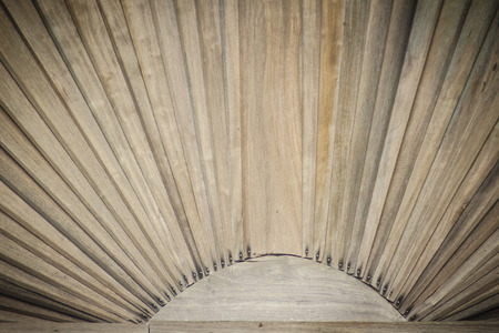 Vintage wooden gable of Thai style house with sun shape and radius background. It is believed that the sun will bring prosperity to the people in the house.の写真素材