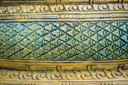 Grungy green stucco pattern of serpent scales for background. Naga scales pattern painted with green...