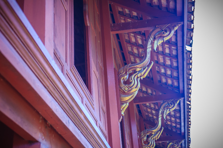 Beautiful northern thai style house pattern of teak wood craving on balcony baluster. Antique...