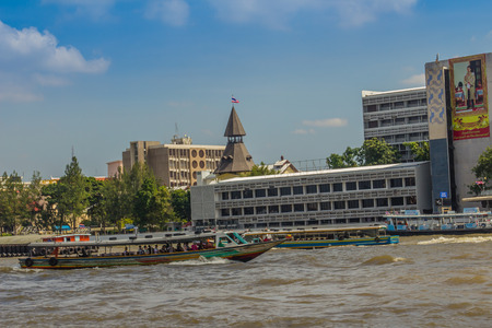Bangkok, Thailand - November 29, 2017: Tha Pra Chan pier, a pier on the historic Bangkok, located on the eastern bank of the Chao Phraya River and beside Thammasat University's campus.のeditorial素材