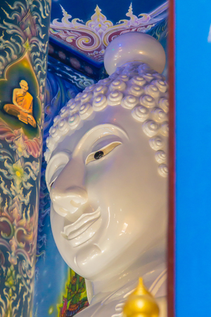 Beautiful white giant Buddha image inside the Buddhist church at Wat Rong Suea Ten Temple, also known as the Blue Temple, locate at Chiang Rai province, northern part of Thailand.の写真素材