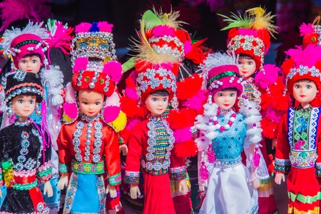 Colorful tribal dolls for sale to the tourist as the souvenir at the local market in Chiang Rai, the northern part of Thailand.の写真素材