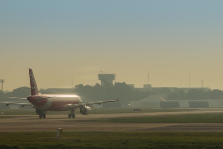 Don Mueang International airport, Bangkok, Thailand-November 18, 2017: Airbus A320 of Thai AirAsia is taxiing on the runway before taking off. AirAsia company is the largest low cost airlines in Asia.のeditorial素材