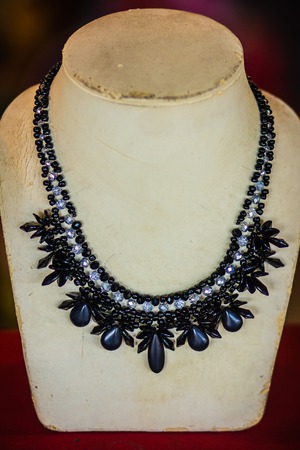 Beautiful stone necklace on jewelry window display in jewelry shop.の写真素材