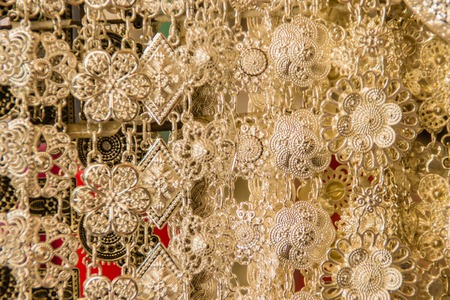 Beautiful vintage silver belts pattern detailed in thai style fashion for women in the antique market. Shop for souvenir handcraft belt as vintage fashion for sale in a jewelry shop in Thailand.の写真素材