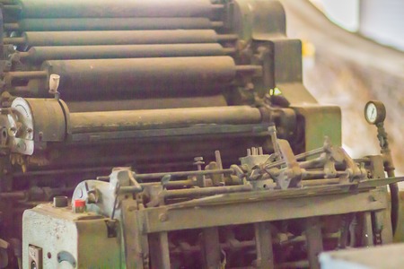 An old printing press machine with rotary equipments. Close up detail of an old printing press.の写真素材