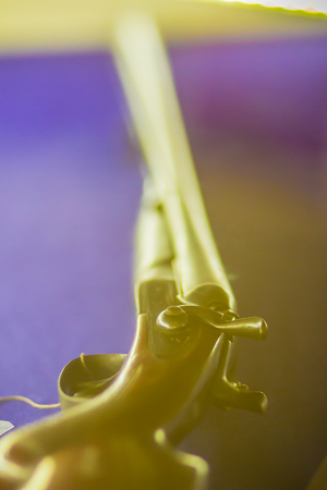 Close up an old side-by-side shotgun or hunting double-barreled shotgun, hunting vintage rifle...