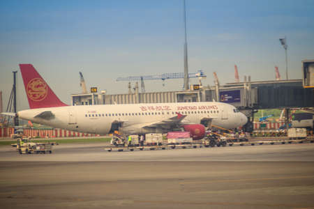 Bangkok, Thailand - August 9, 2017: Juneyao aircraft docking at terminal to upload the baggage and wait for the passenger on board at Suvarnabhumi International airportのeditorial素材