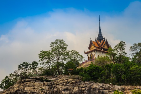 Beautiful white buddhist pavilion on the hilltop with blue sky background at Wat Phraputthachai temple, Saraburi, Thailand. This temple is public for entry and tourist can enjoy the 360-degree view.の写真素材