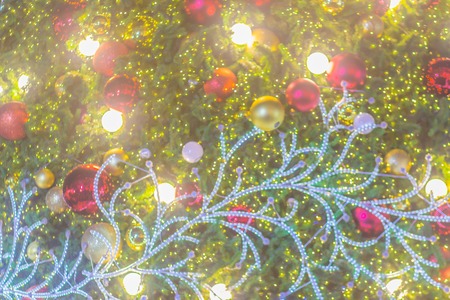 Abstract blurred colorful Christmas tree lighting decoration with bokeh background. Defocused of...