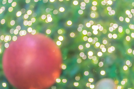 Abstract blurred colorful Christmas tree lighting decoration with bokeh background. Defocused of...