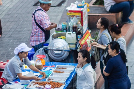 Street hawker fried chicken food for sale on the street.のeditorial素材