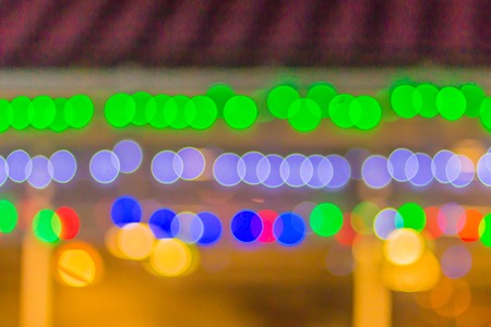 Abstract blurred circular bokeh background. Defocused background with bokeh of LED light decoration during Christmas and new year festival.の写真素材