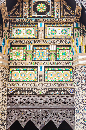 Beautiful Lanna's style pattern background on the Buddhist church gable end. Northern Thai golden pattern background crafts on the gable in the Buddhist temple with Lanna style at Chiang Mai, Thailandの写真素材