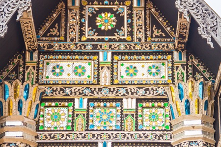 Beautiful Lanna's style pattern background on the Buddhist church gable end. Northern Thai golden pattern background crafts on the gable in the Buddhist temple with Lanna style at Chiang Mai, Thailandの写真素材