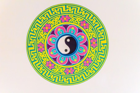 Golden symbol of Yin - Yang on the ceiling of Chinese temple. Yin and Yang is that all things exist as inseparable and contradictory opposites, for example, female-male, dark-light and old-young.のeditorial素材