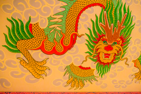 Colorful architecture and art of wall painting with red dragon pattern in the public Chinese temple. Tradition red Chinese dragon painting on Chinese temple wallのeditorial素材