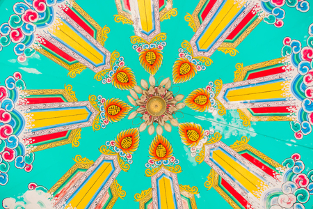 Beautiful painting pattern on the ceiling shrine in chinese style. Imitation of chinese ceiling painting. Abstract pattern painted by watercolor on the ceiling in public Chinese temple.のeditorial素材