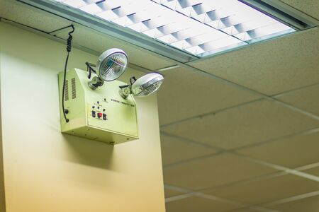 Automatic emergency lights with two lamps in the office. Automatic flood lights, emergency lights, hallway lightsの写真素材