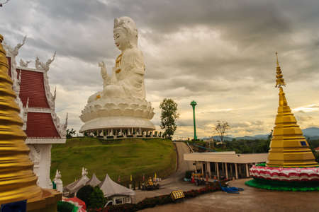 White statue of Guanyin at Wat Huay Plakang, Chiang Rai, Thailand. Guan Yin is a female Bodhisattva in Thai Buddhism, which means someone that reached enlightenment.のeditorial素材