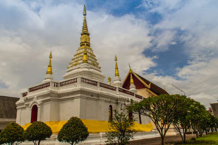 Beautiful landscape and white gold pagoda of Wat Jedyod, Chiang Rai, Thailand. Wat Chet Yot is a temple that has been renovated from the remains of an ancient temple.の写真素材