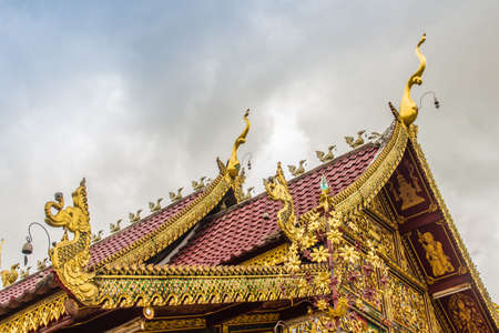 Beautiful art, religious places and religious objects in Myanmar mixed with Lanna style at Wat Ming Muang Buddhist temple, Chiang Rai, Thailand. Mixed Lanna and Burmese arts.の写真素材