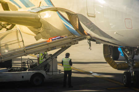 Bangkok, Thailand - June 13, 2017: Airplane staffs of Bangkok Airways (a regional airline based in Bangkok) is uploading baggage before taking off at Suvarnabhumi Airport.のeditorial素材
