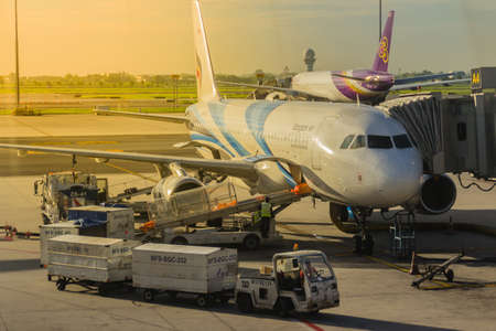 Bangkok, Thailand - June 13, 2017: Airplane staffs of Bangkok Airways (a regional airline based in Bangkok) is uploading baggage before taking off at Suvarnabhumi Airport.のeditorial素材