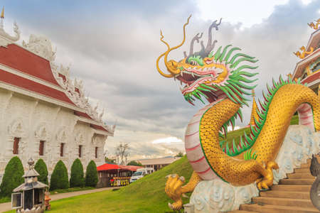 Yellow dragon head at Wat Huay Pla Kang, bublic Chinese temple in Chiang Rai Province, Thailand with...