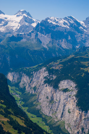 View of the valley in the mountains from the top of Mannlichen Jungfrau region, Bern, Switzerland.の写真素材