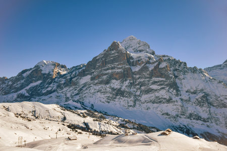 Beautiful winter mountain landscape in Sunny weather with views of Wetterhorn 3692m mountain peak. Grindelwald, Bernese Oberland Switzerland.の写真素材