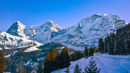 Jungfrau, Eiger and Monch Mountain peaks in winter Swiss Alps, Bernese Oberland Switzerlandの写真素材
