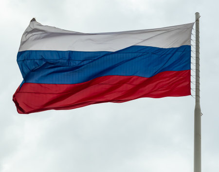 Russian flag flying on a flagpole in a strong wind. symbol of patriotism. Tula. Russiaの写真素材
