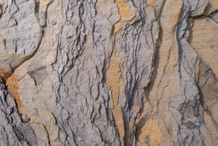Layered rock with red veins in the Swiss Alps as background.
