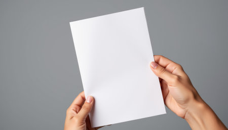 Hand holding blank flyer, design potential for marketing projects. generated by aiの写真素材